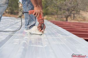 Man Installing a Corrugated Metal Roof